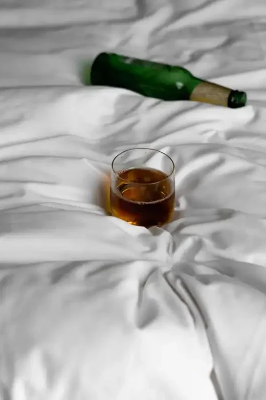 wine glass and alcohol in the bed