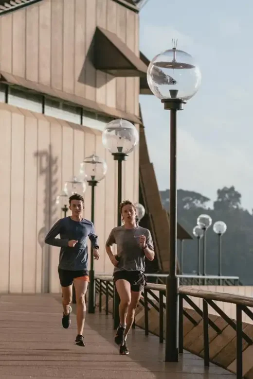 photo of two men running