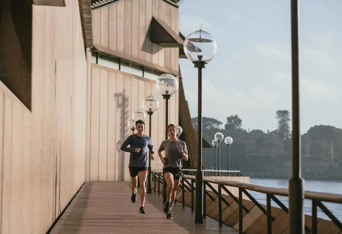 photo of two men running