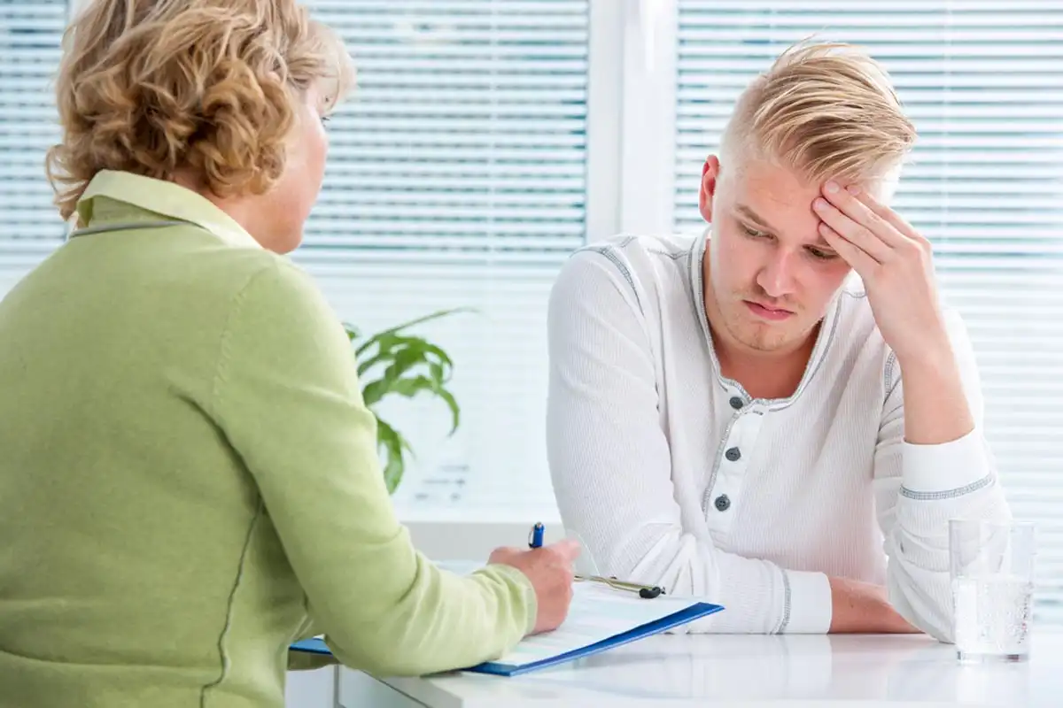 millennial getting prescription drugs from a health professional