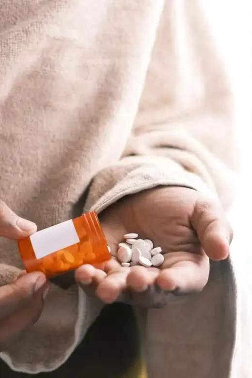 photo of a person taking pain killers