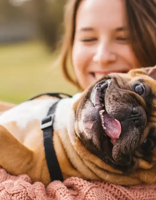 woman playing with her dog