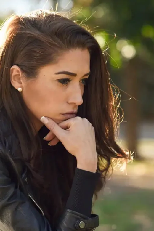 photo of a sad woman worring about a lot of things