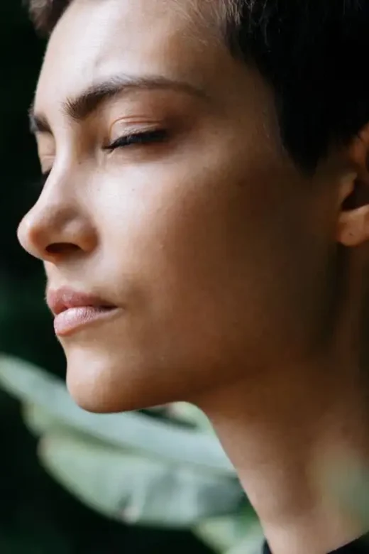 photo of a woman meditating in the forest