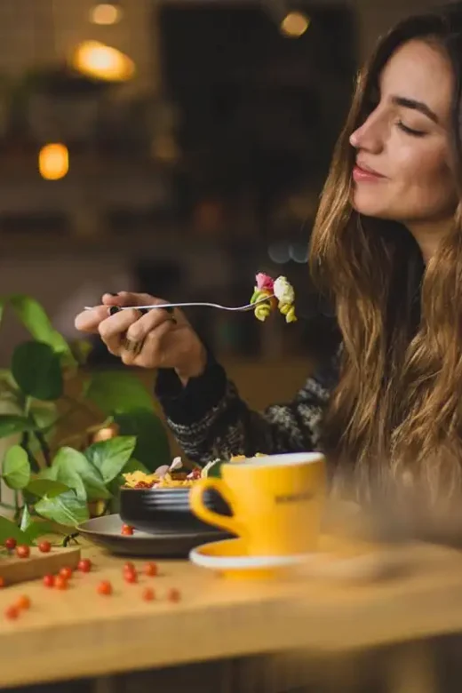 a photo of a beautiful woman eating healthy foods