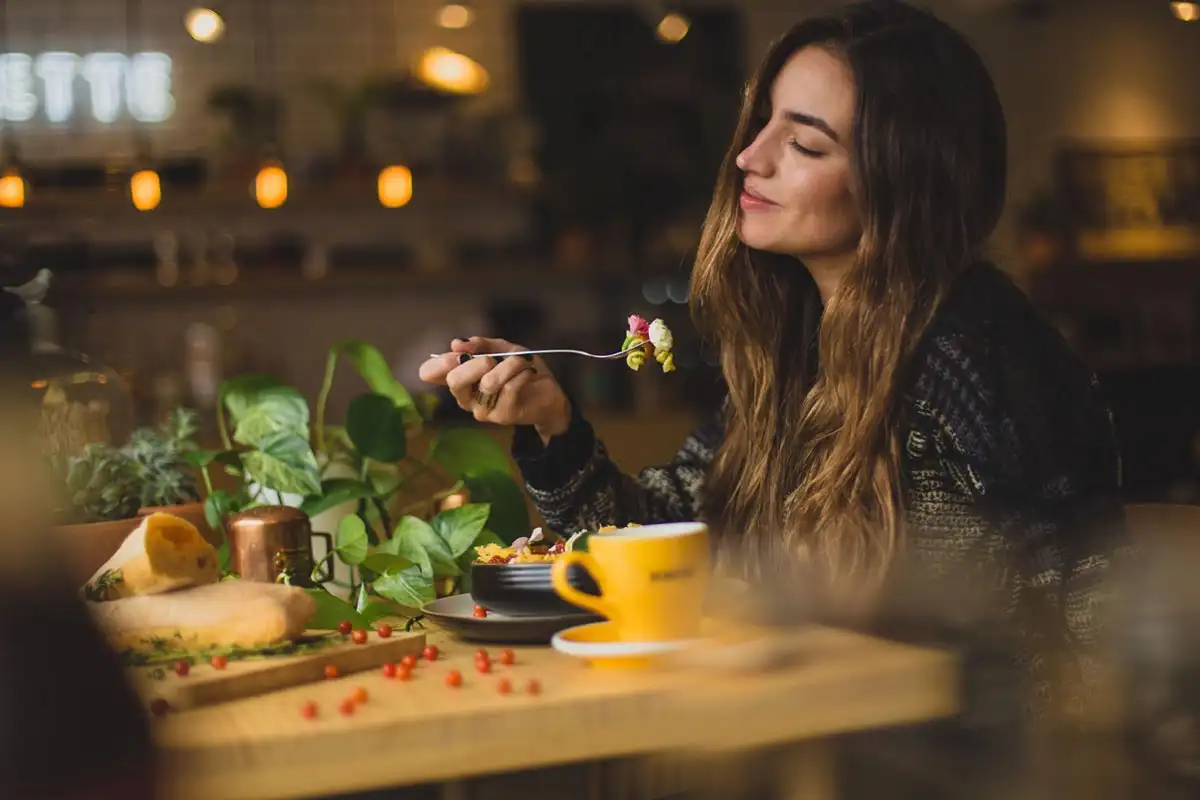a photo of a beautiful woman eating healthy foods