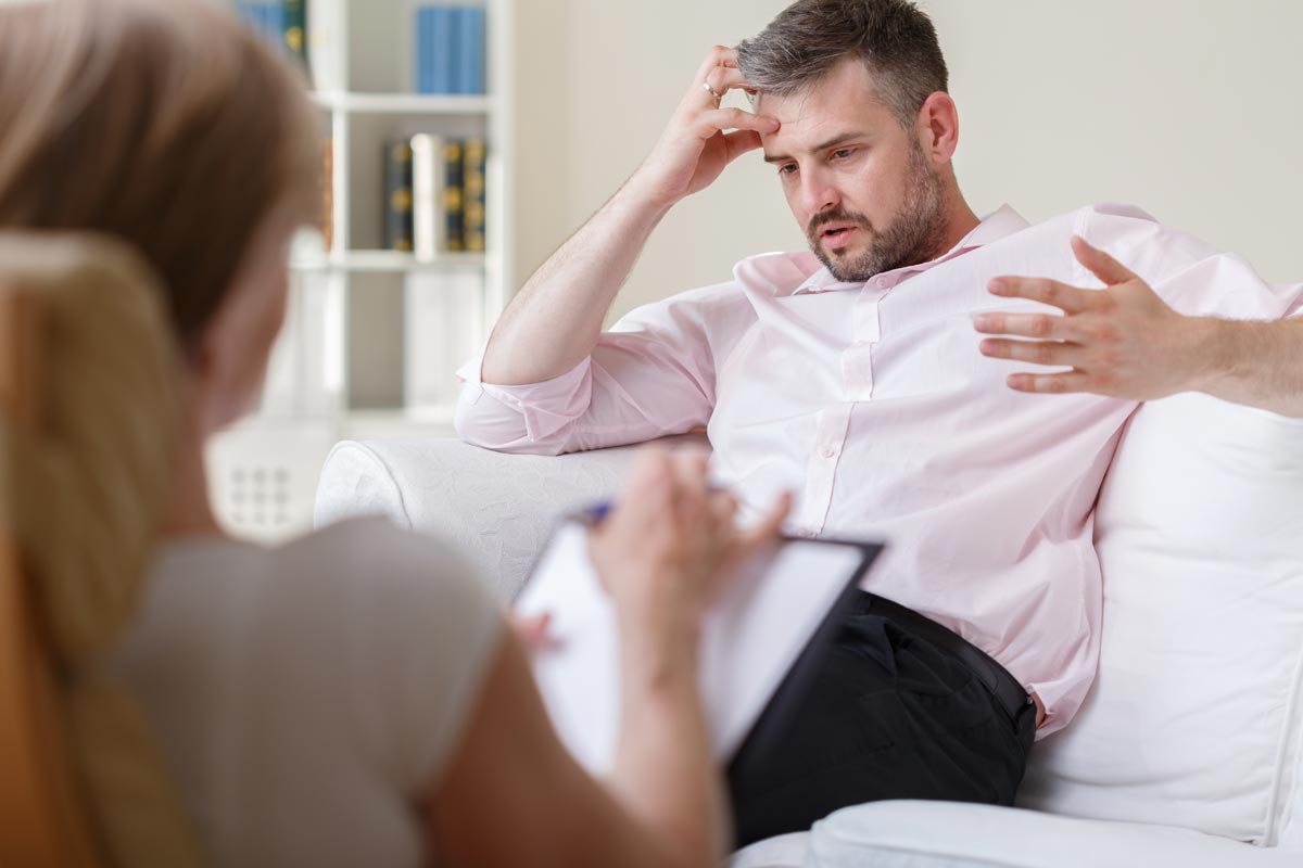 photo of man talking to a psychologist during his Treatment for Opiate Addiction