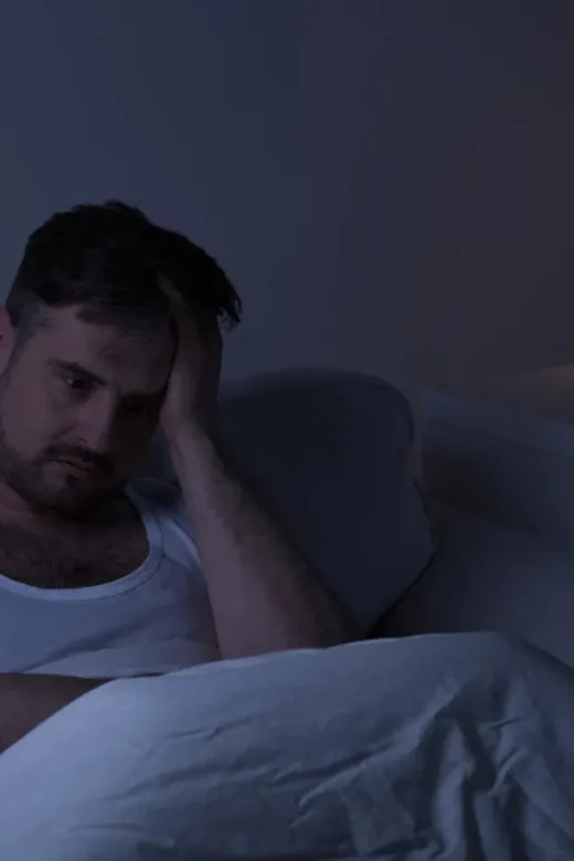 photo of a man who can't sleep because he's starting to have a relapse