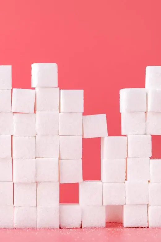 photo of sugar cubes on pink background