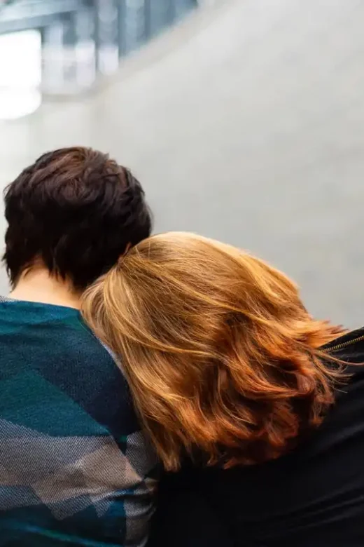 photo of two women comforting each other showing empathy