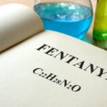 Book with fentanyl and test tubes