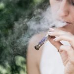 a photo of a lady with marijuana addiction smoking pot