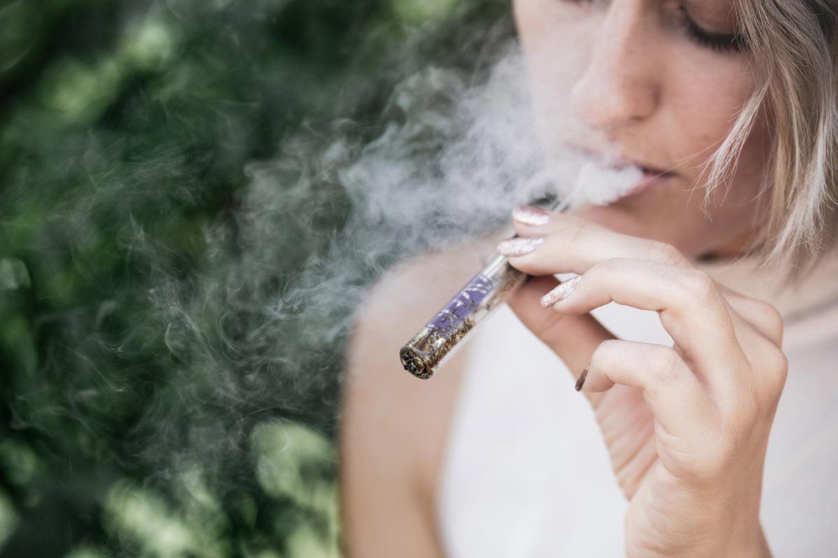 a photo of a lady with marijuana addiction smoking pot
