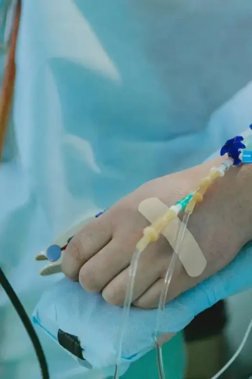 man lying in bed hospitalized because of drug overdose