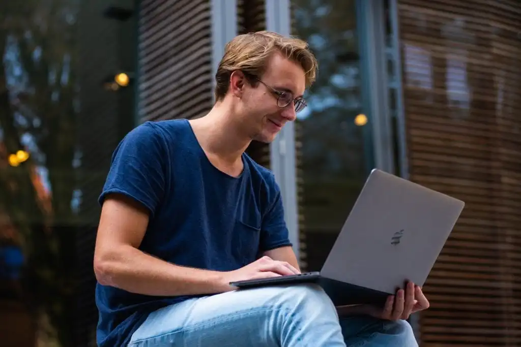 Man researching substance abuse on his laptop