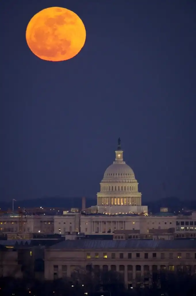 Full moon over the US Capitol building in Washington DC