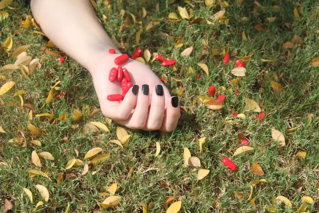 pills in the hand of a woman drug overdose opioid epidemic California