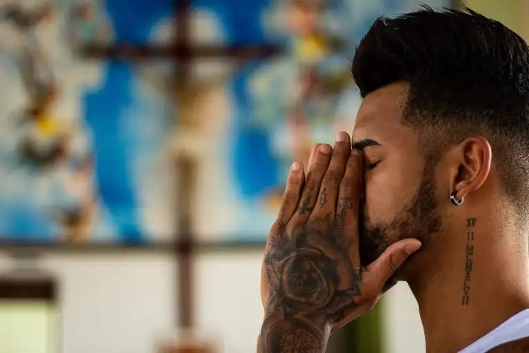 Man deep in prayer at a church in the downtown Los Angeles area