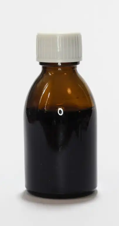 a bottle of cough syrup that contains psychoactive compound DXM
