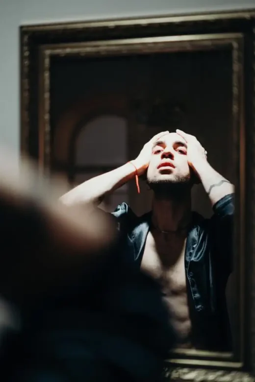man looking at the mirror drug implants struggle addiction medicine