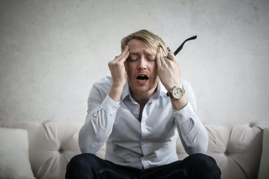 Business professional who is stressed out from work. They might be using drugs to cope with the stress
