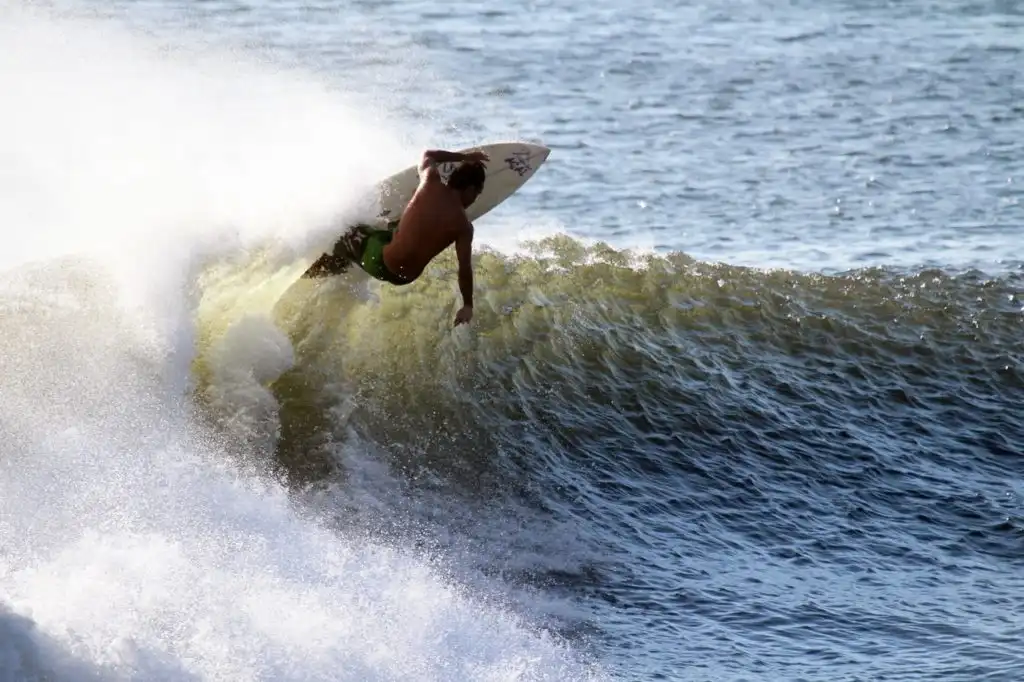 Person surfing on the waves in southern California. Just outside Los Angeles CA