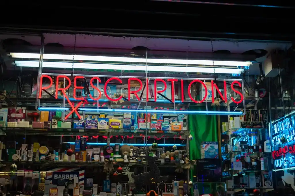 a Los Angeles pharmacy with neon lights. Symbolizing opioid and heroin addiction