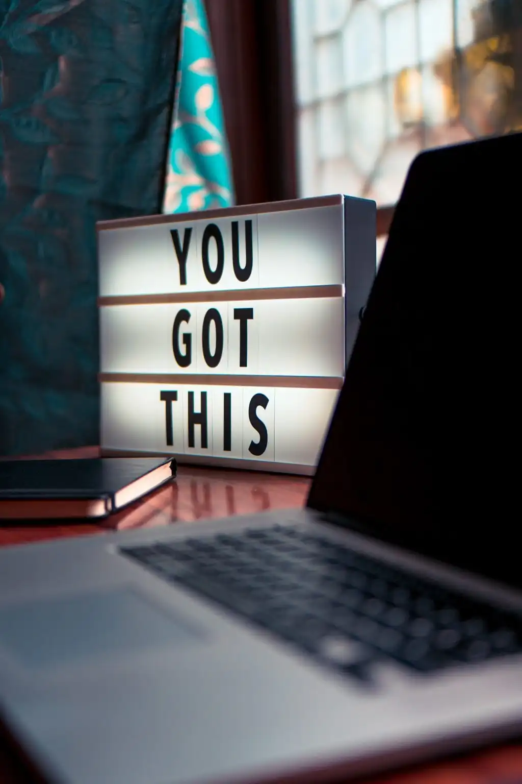 a desk with you got this written on a marquee