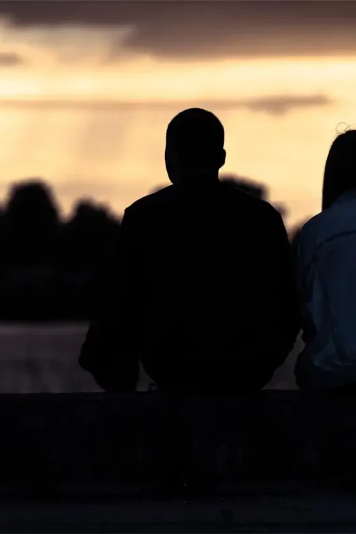 a couple having deep conversation during sunset Couples Addiction Recovery