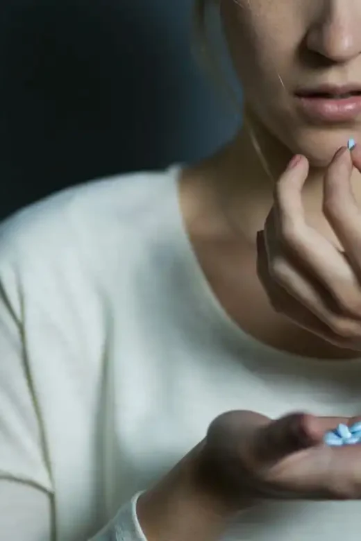 woman taking post-surgery pain medication