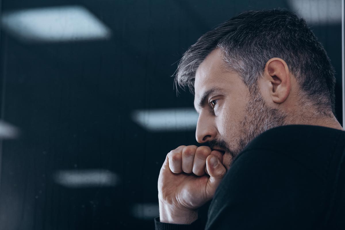 photo of a man with withdrawal symptoms in rehab center for drug addicts