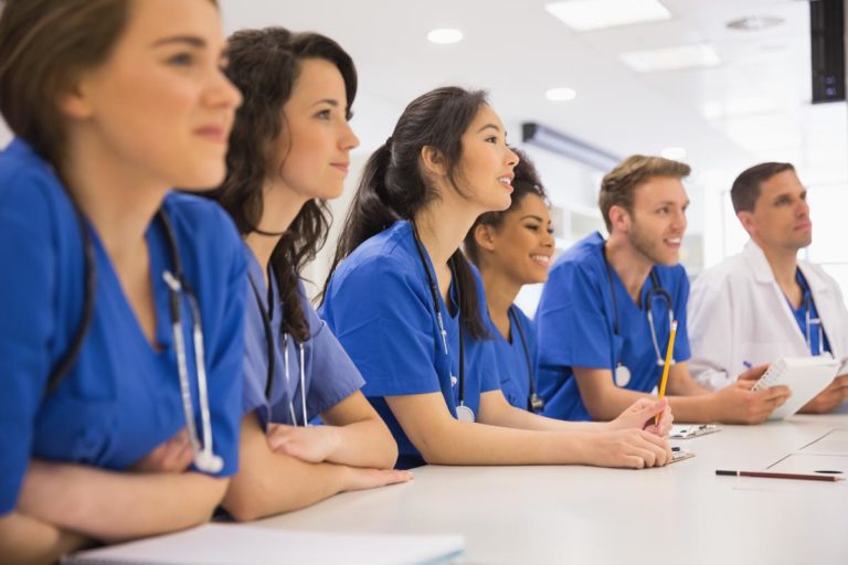 photo of Medical students listening sitting at desk at the university