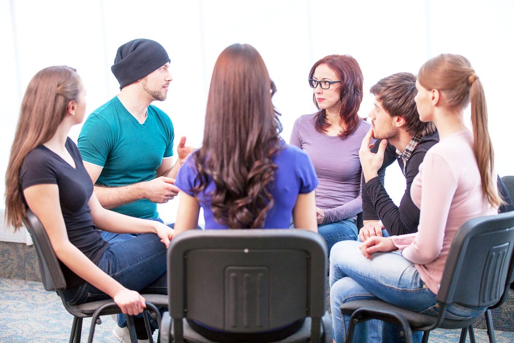 people during a group therapy Alcoholics Anonymous (AA)