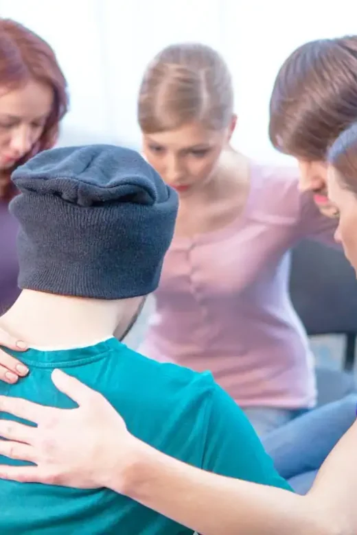 people from a self-help group during therapy
