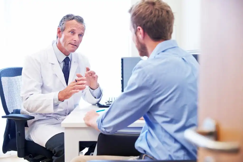 man consulting a doctor regarding alcohol detox