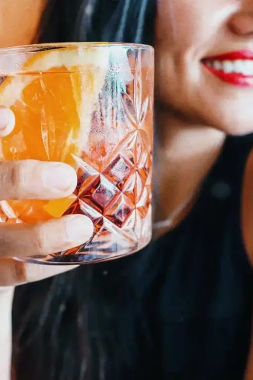 a woman drinking alcoholic breverage