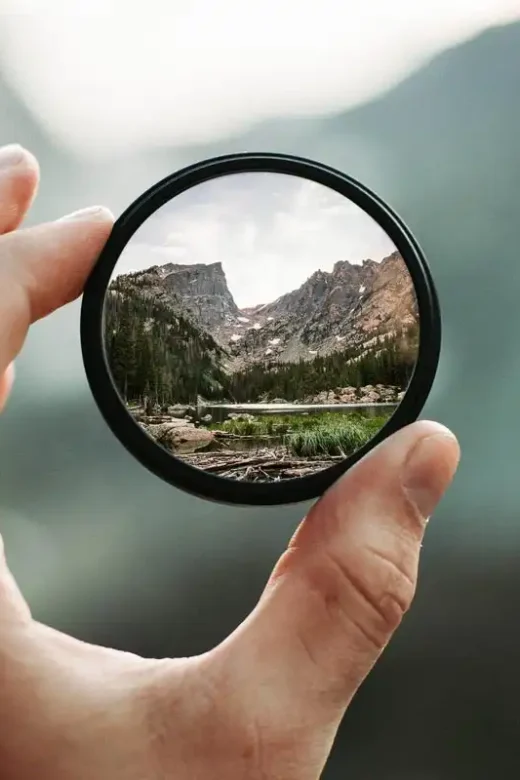 hand holding a magnifying glass Sober Curious concept