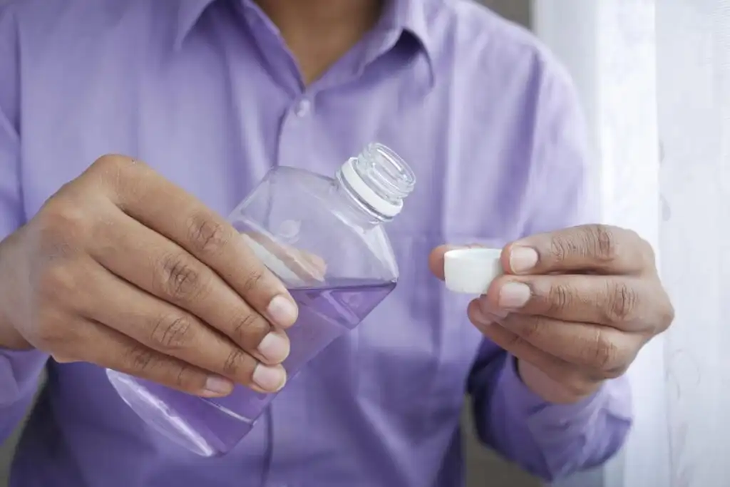 man doing toxin clearing gums and mouthwashes to use before taking a test