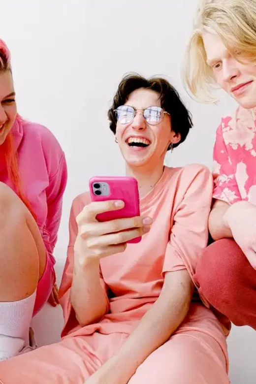 three people wearing pink clothes member of lgbtq+community