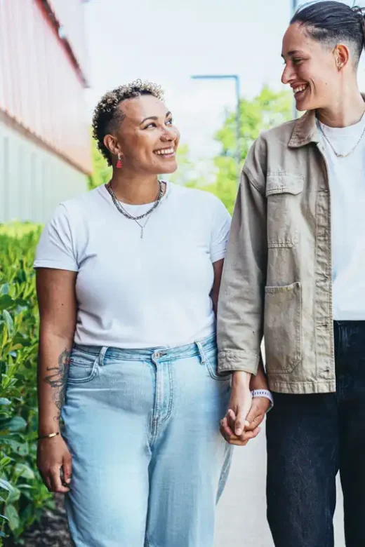 two couple walking hand in hand