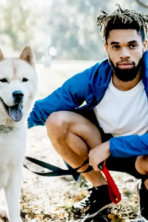 young man hanging out with his dog at the rehab center