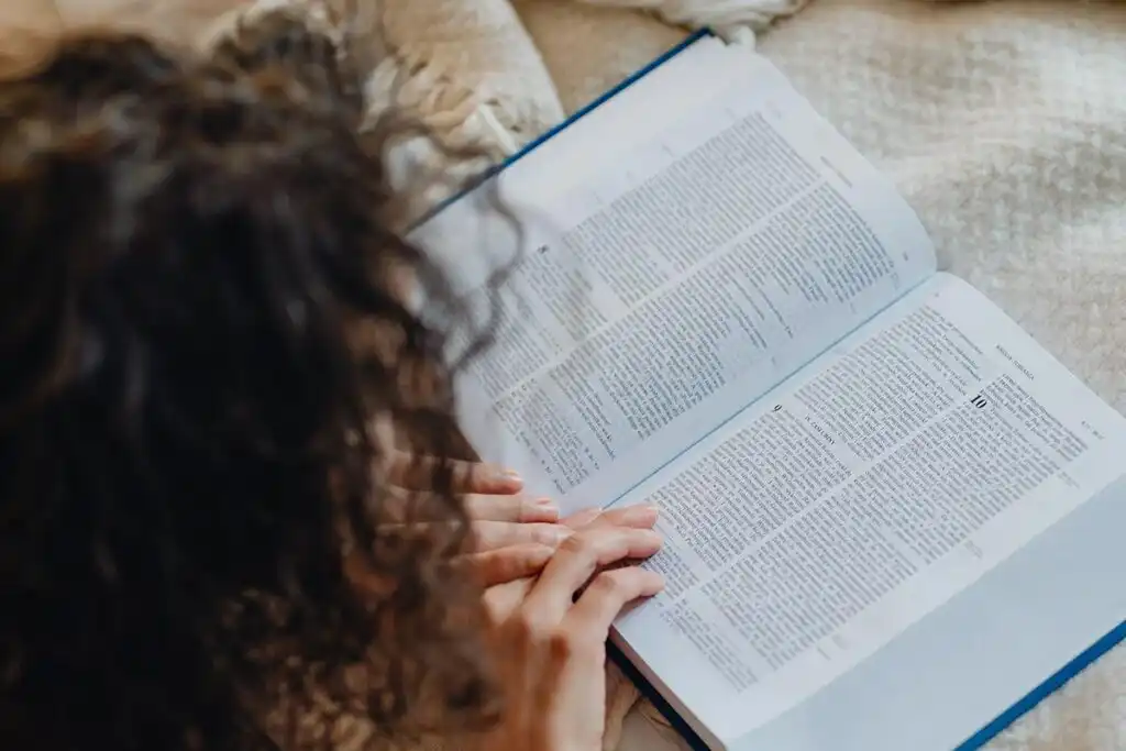 a woman reading bible during her quiet time
