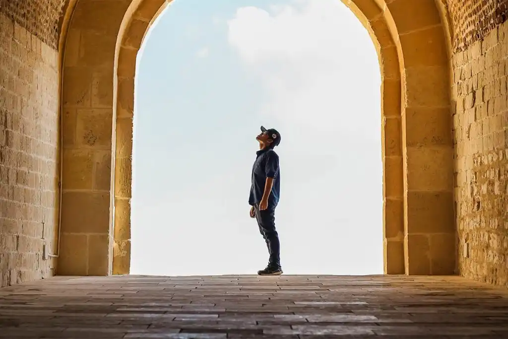 man looking up the sky
