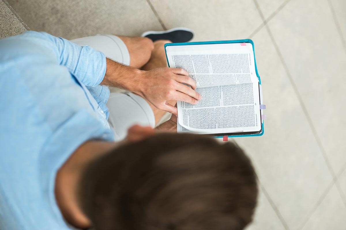 man reading bible during his quiet time