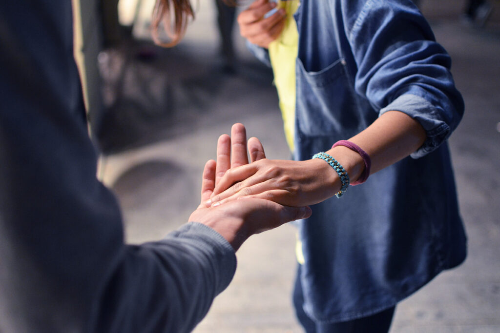 an addiction treatment expert offers helping hand to a woman struggling with substance abuse