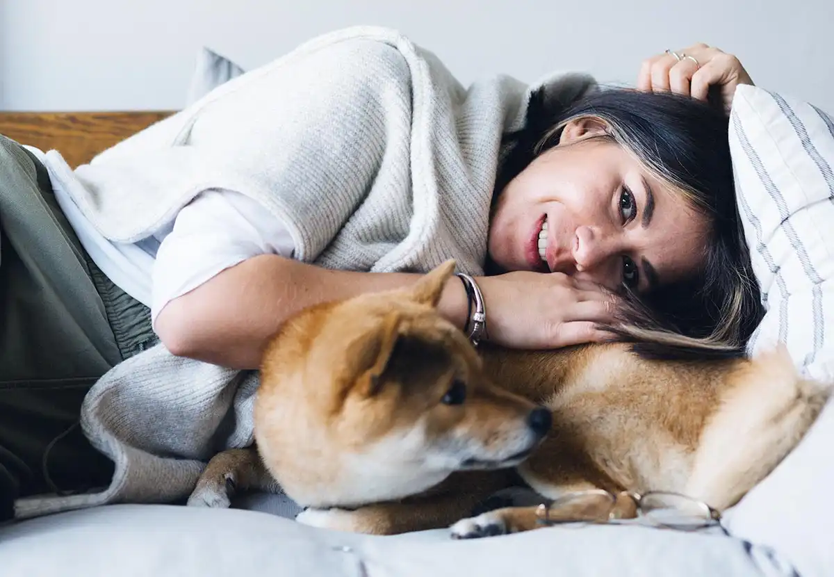 Woman Taking Care of her Pet after recovery
