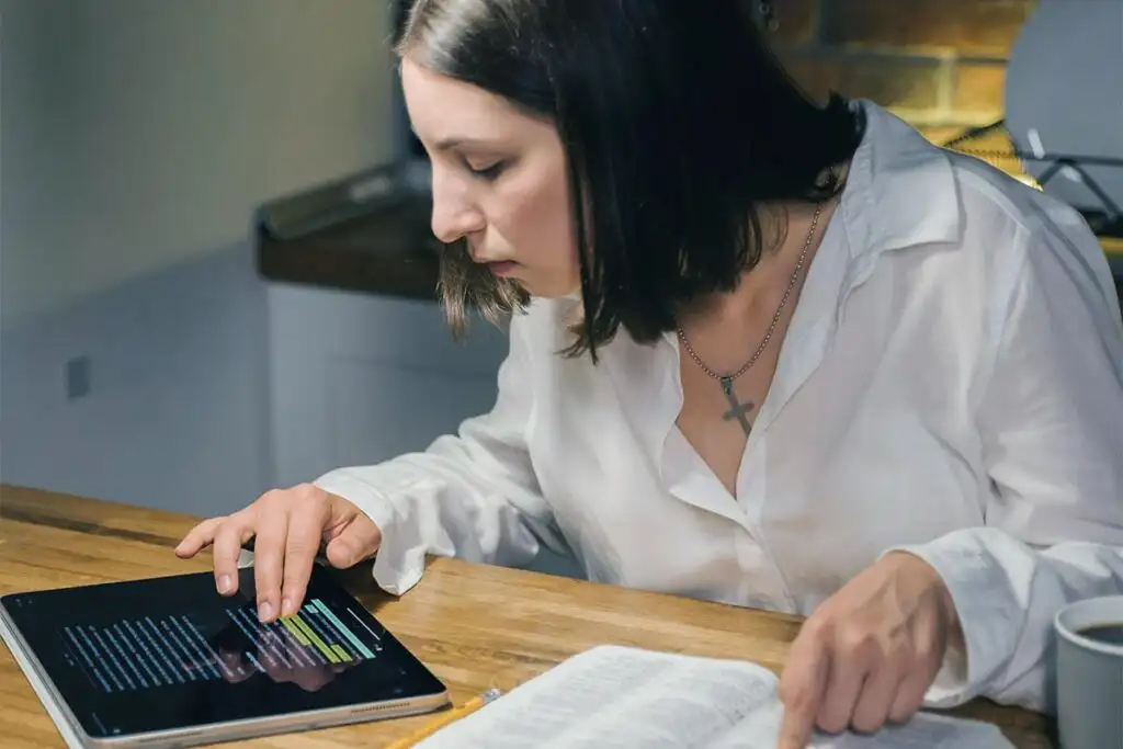 a woman recovering from substance abuse getting comfort from reading the scripture in the Bible