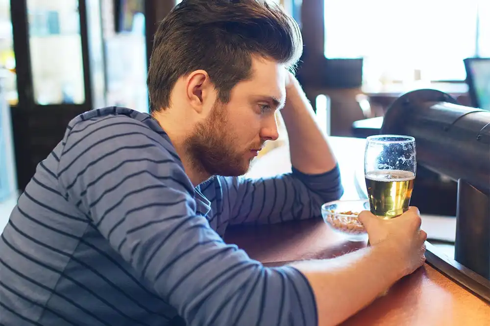 man drinking alcohol addiction treatment center in Riverside CA