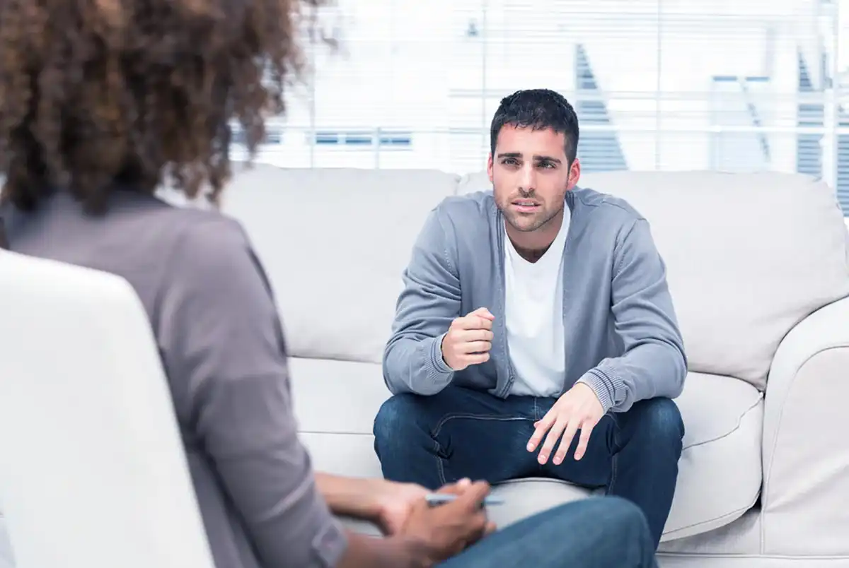 man getting into addiction treatment center in Riverside CA