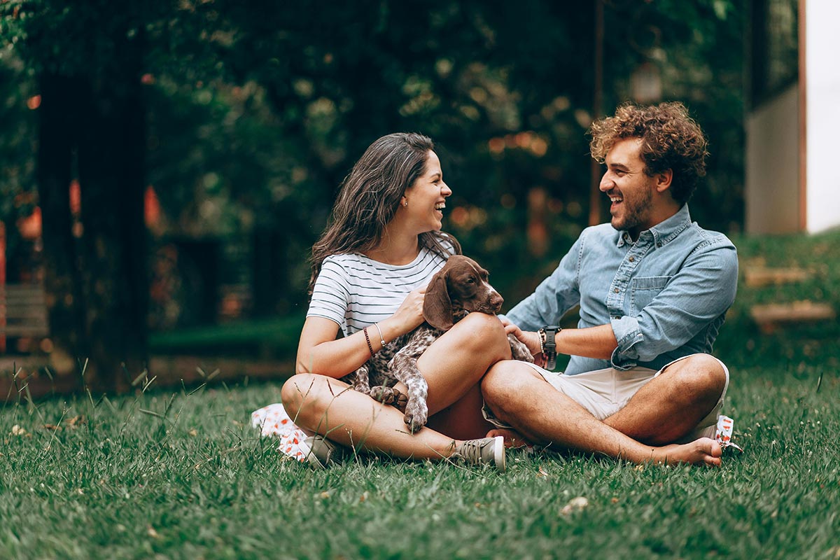 a couple with their pet at a drug and alcohol pet friendly rehab center